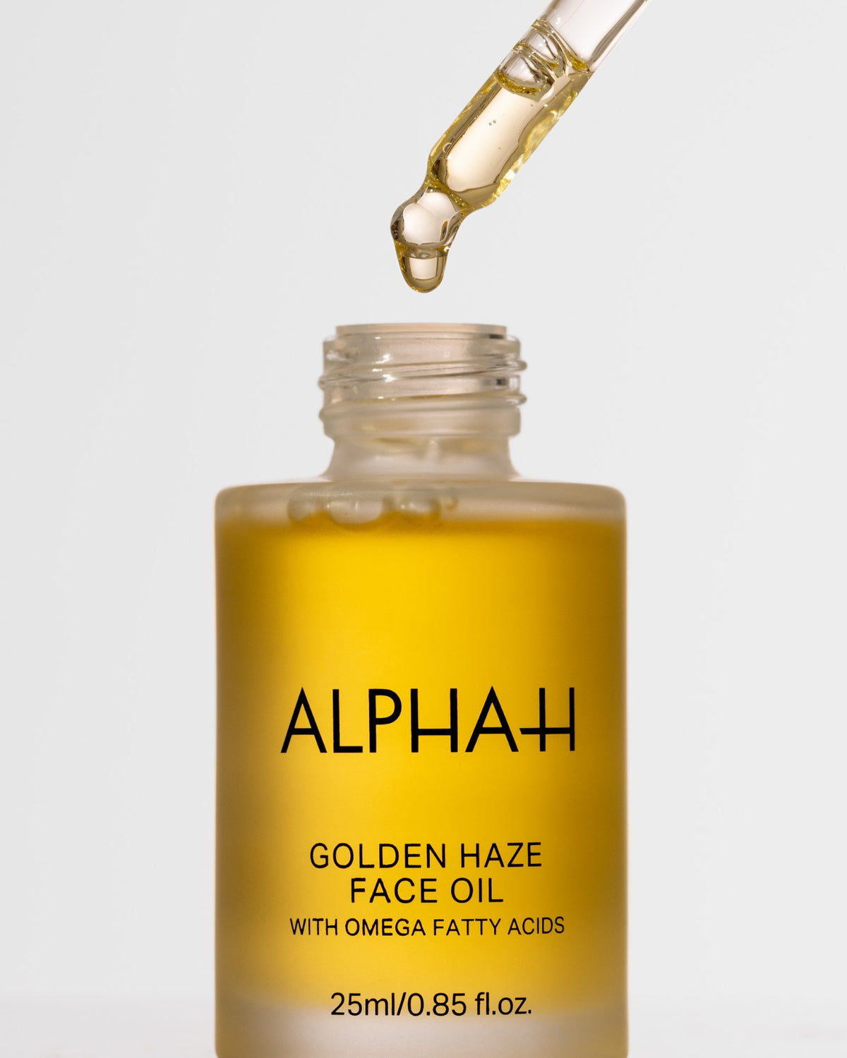 Alpha-H Golden Haze Face Oil frasco con pipeta