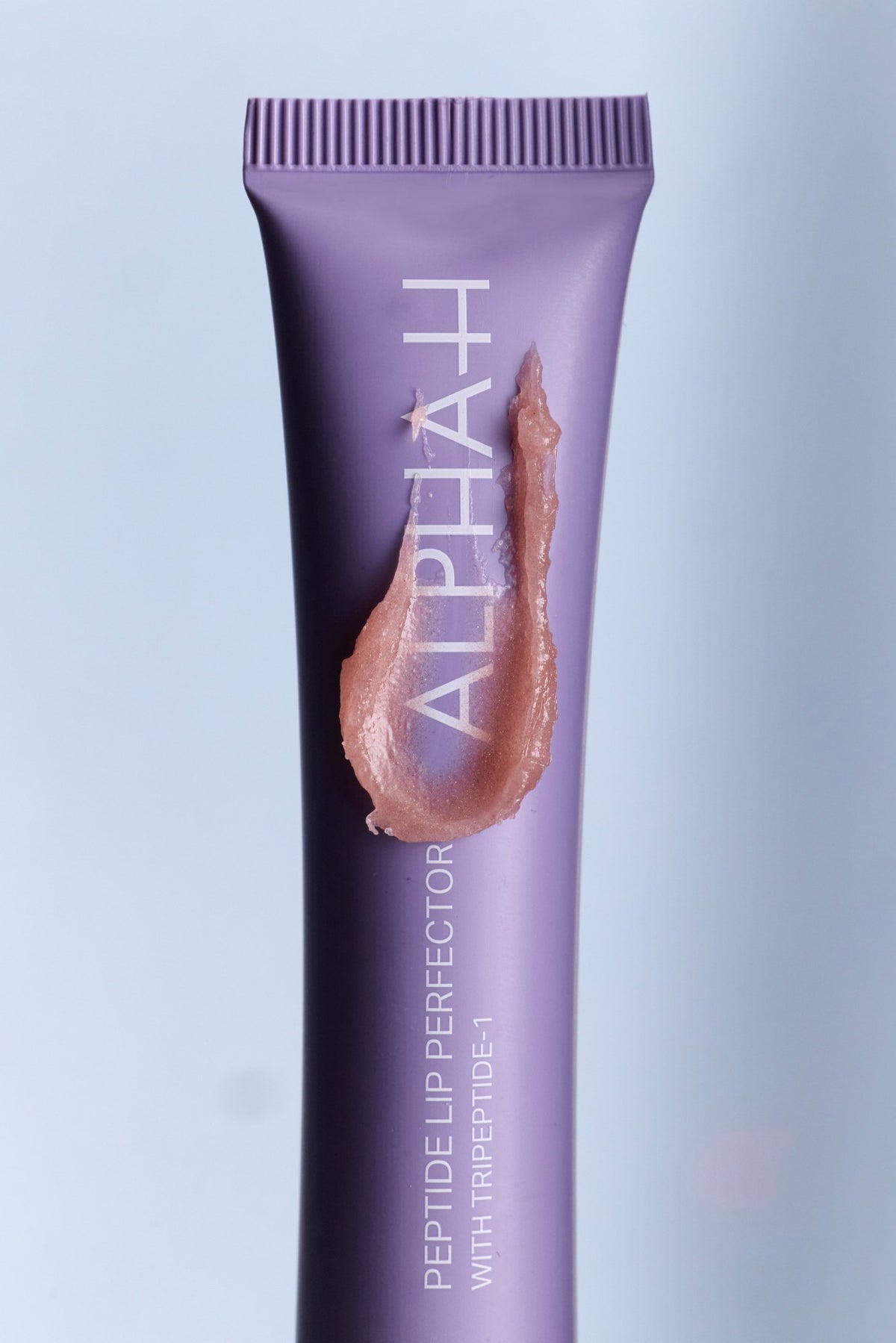 Alpha-H Peptide Lip Perfector tubo con textura