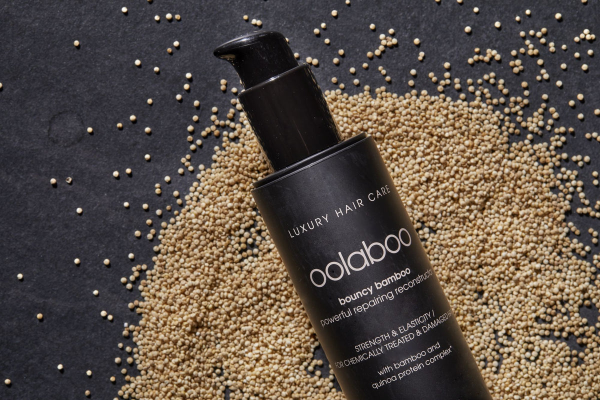 Oolaboo Bouncy Bamboo Repair Shampoo sobre un lecho de semillas