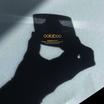Oolaboo Saveguard Protective Shield SPF30 con la sombra de una mano